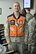 Tech. Sgt. Russell Thompson, a member of 910th Security Forces Squadron, wears a safety vest here, June 7, 2015. Use of the orange vests is encouraged by the command for those commuting on the base to increase the visibility of motorcyclists. U.S. Air Force photo/Tech. Sgt. Jim Brock.