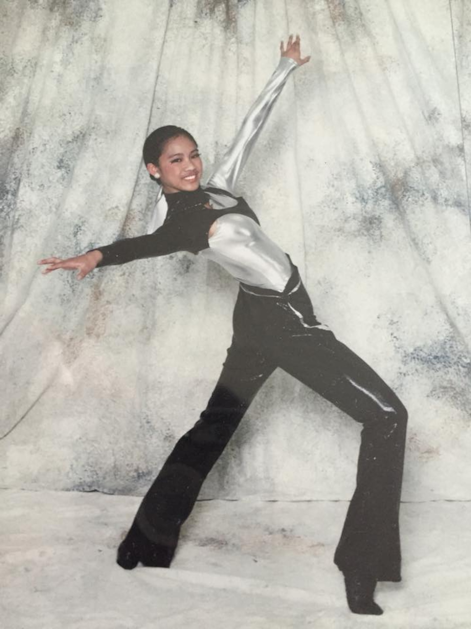 Senior Airman Jessica Turney, 374th Operations Support Squadron air traffic controller, poses during a dance studio shoot at Virginia Beach, Virginia, 2005. Turney started dancing in high school, 10 years ago. (Courtesy photo)
