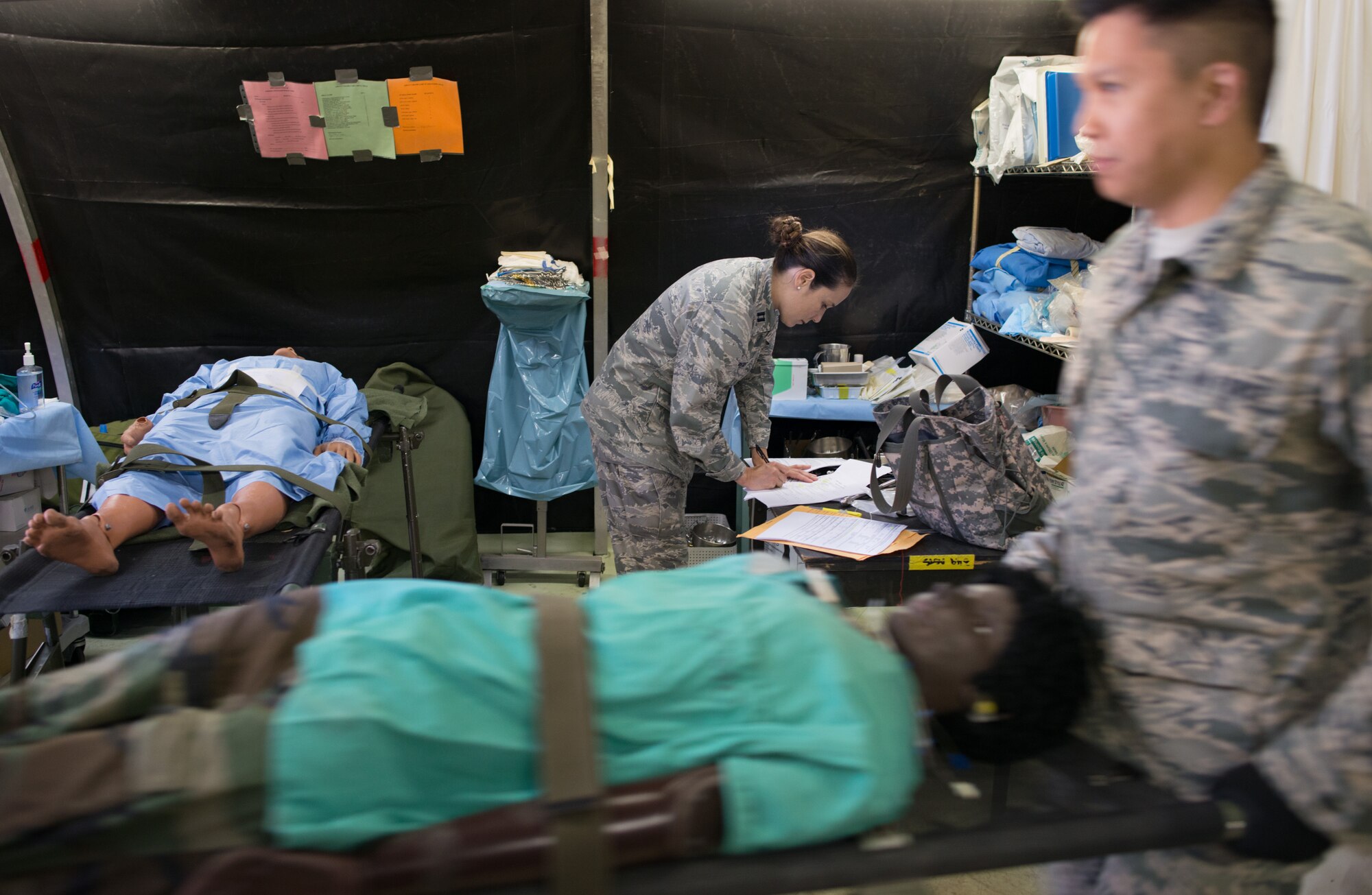 Airmen from the 349th Air Mobility Wing at Travis AFB, Calif., teamed up with the Army National Guard and Navy Reserve to hone their emergency response skills during a June 6, 2015 training exercise. Responding to an earthquake disaster scenario, Airmen practiced triage, medical evacuation and the airlift of equipment, supplies and personnel. (U.S. Air Force photo by Ken Wright/Released) 