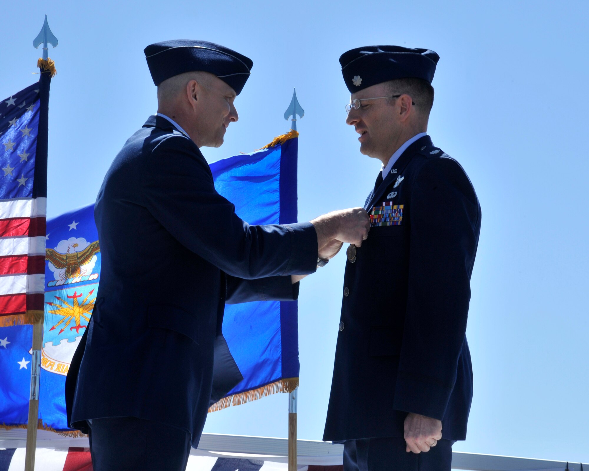 Lt. Col. David Pike, 92nd Operations Group deputy commander, pins a Meritorious Service Medal on Lt. Col. Jeromie Sheldon, the former 92nd Air Refueling Squadron commander, June 11, 2015, at Fairchild Air Force Base, Wash. Sheldon received his second Meritorious Service Medal earning him an oak leaf cluster. The Meritorious Service Medal is a military award presented to members of the United States Armed Forces who distinguished themselves by outstanding meritorious achievement or service to the United States. (U.S. Air Force photo/Airman 1st Class Taylor Bourgeous)