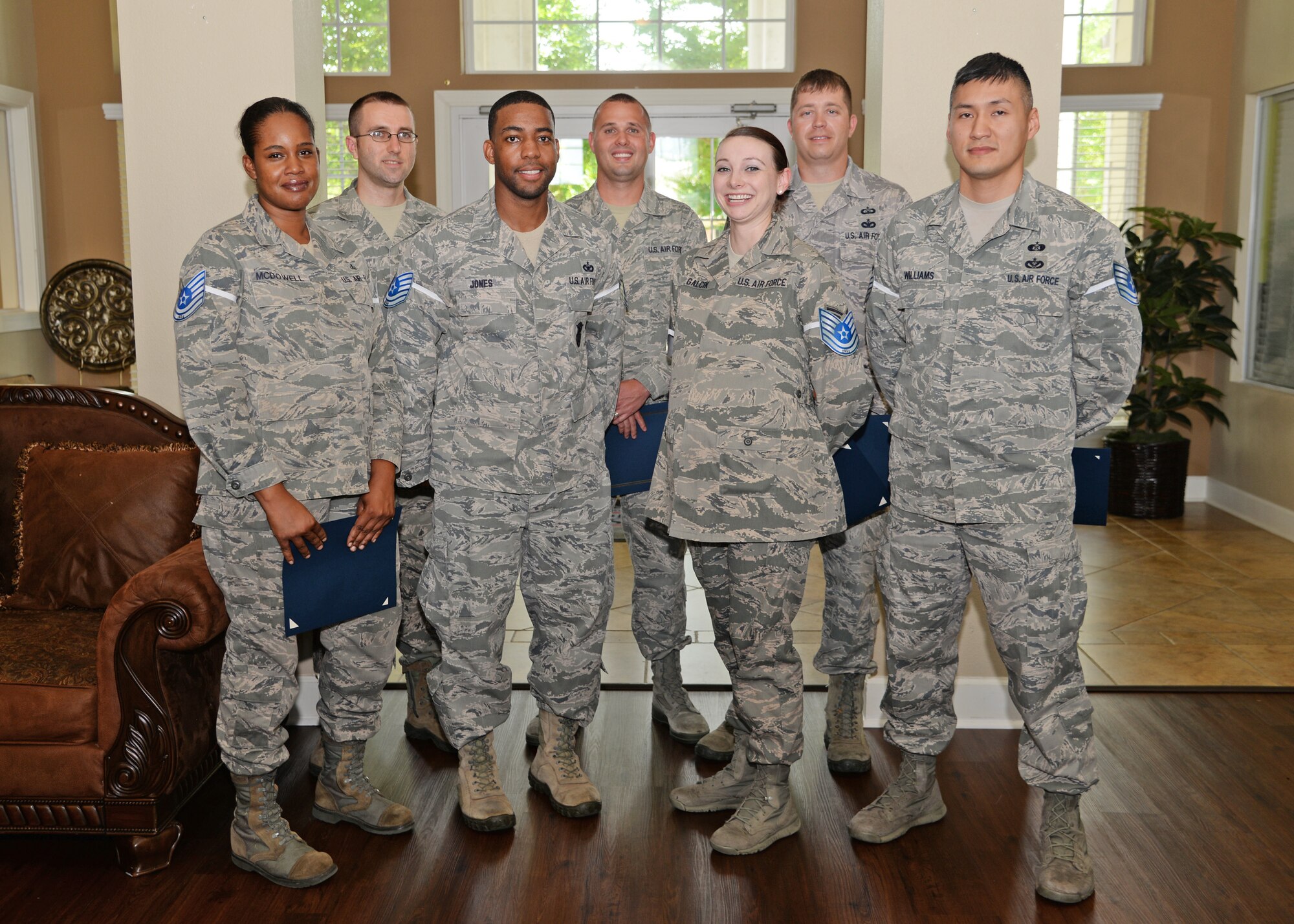 Nine Team BLAZE technical sergeant selects gather for a party celebrating their promotion June 11 at Columbus Air Force Base, Mississippi. Following a congratulatory speech for Col. Howard McArthur, 14th Flying Training Wing Vice Commander, the technical sergeant selects enjoyed a celebration with hamburgers and drinks.(U.S. Air Force photo/Senior Airman Stephanie Englar)