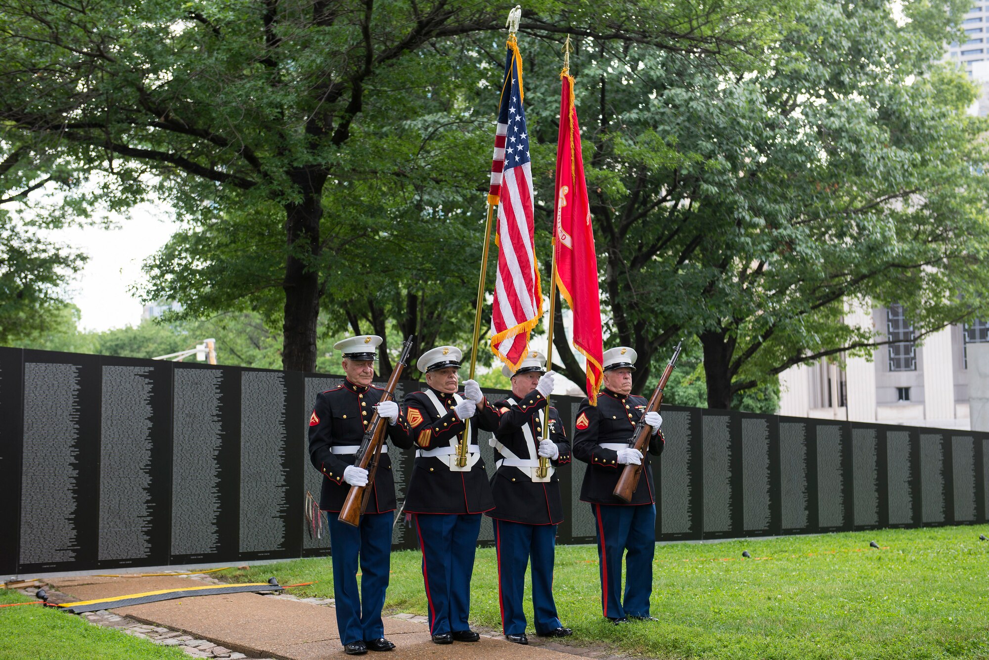 The Marine Corps League present colors at the beginning of the American Veterans Traveling Tribute at the Eternal Flame Park, St. Louis, Missouri, June 5, 2015. The Traveling Vietnam Wall is a tribute dedicated to the memory of the servicemembers who lost their lives in the Vietnam War. (U.S. Air Force Photo by Airman 1st Class Megan Friedl)