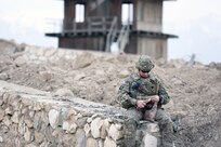 Photo by Michael Stepien
A Soldier checks to see what he has available in this Meal, Ready-to-Eat. MREs were created in 1961 and were adopted in 1975, coming into service in 1981.
Photo by Michael Stepien
