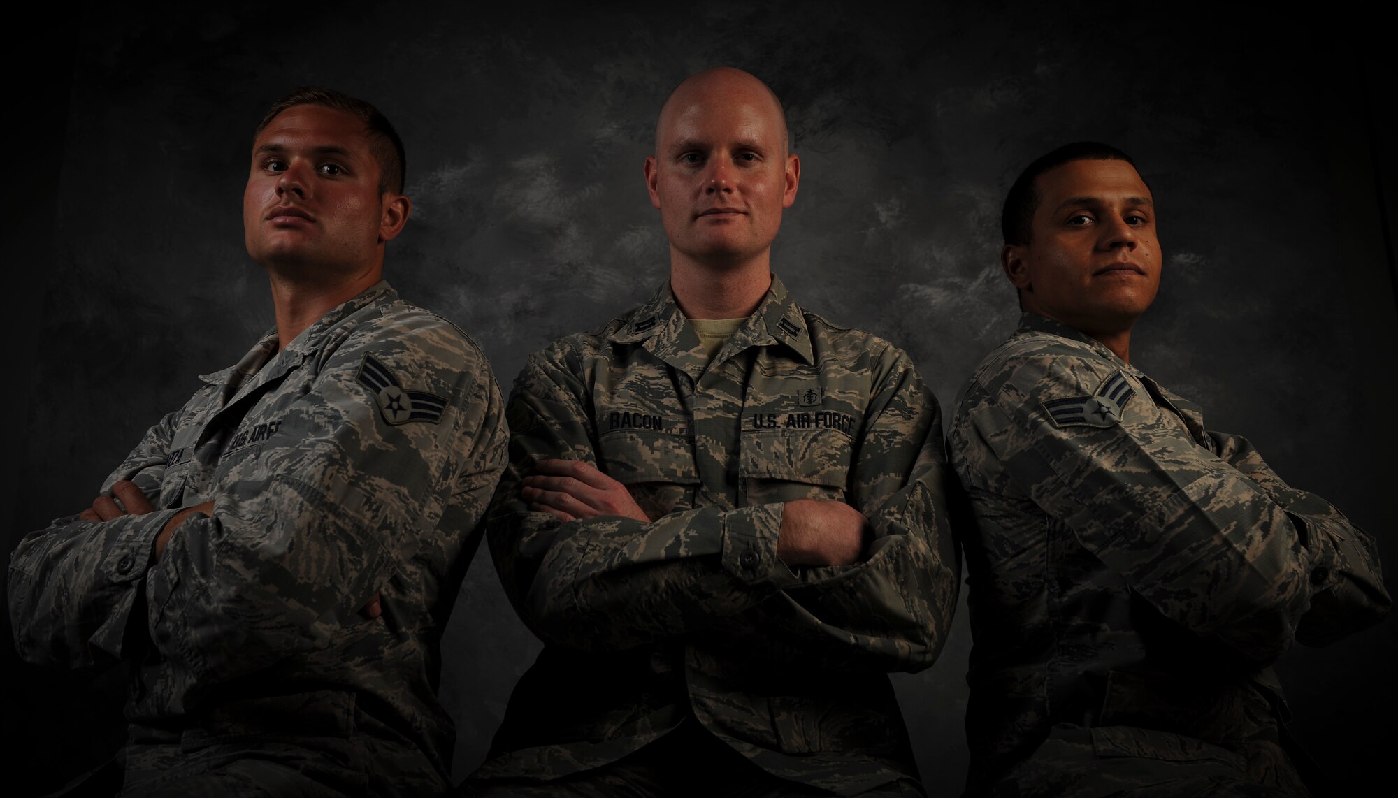 Senior Airman Gregory Tamuzza, 823rd Maintenance Squadron rescue specialist, left, Capt. Lance Bacon, 99th Medical Operations
Squadron emergency medicine physician, and Senior Airman Jerome Coley, 99th Communications Squadron knowledge operator, pose
for a photo at Nellis Air Force Base, Nev., June 9, 2015. The three Airmen’s swift actions helped save the lives of two unconscious passengers
when their vehicle rolled over on Interstate 15, May 31 in Las Vegas. (U.S. Air Force photo by Airman 1st Class Mikaley Towle)