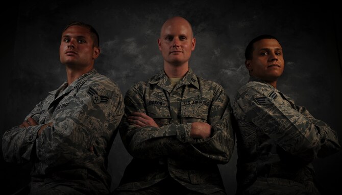 Senior Airman Gregory Tamuzza, 823rd Maintenance Squadron rescue specialist, left, Capt. Lance Bacon, 99th Medical Operations
Squadron emergency medicine physician, and Senior Airman Jerome Coley, 99th Communications Squadron knowledge operator, pose
for a photo at Nellis Air Force Base, Nev., June 9, 2015. The three Airmen’s swift actions helped save the lives of two unconscious passengers
when their vehicle rolled over on Interstate 15, May 31 in Las Vegas. (U.S. Air Force photo by Airman 1st Class Mikaley Towle)