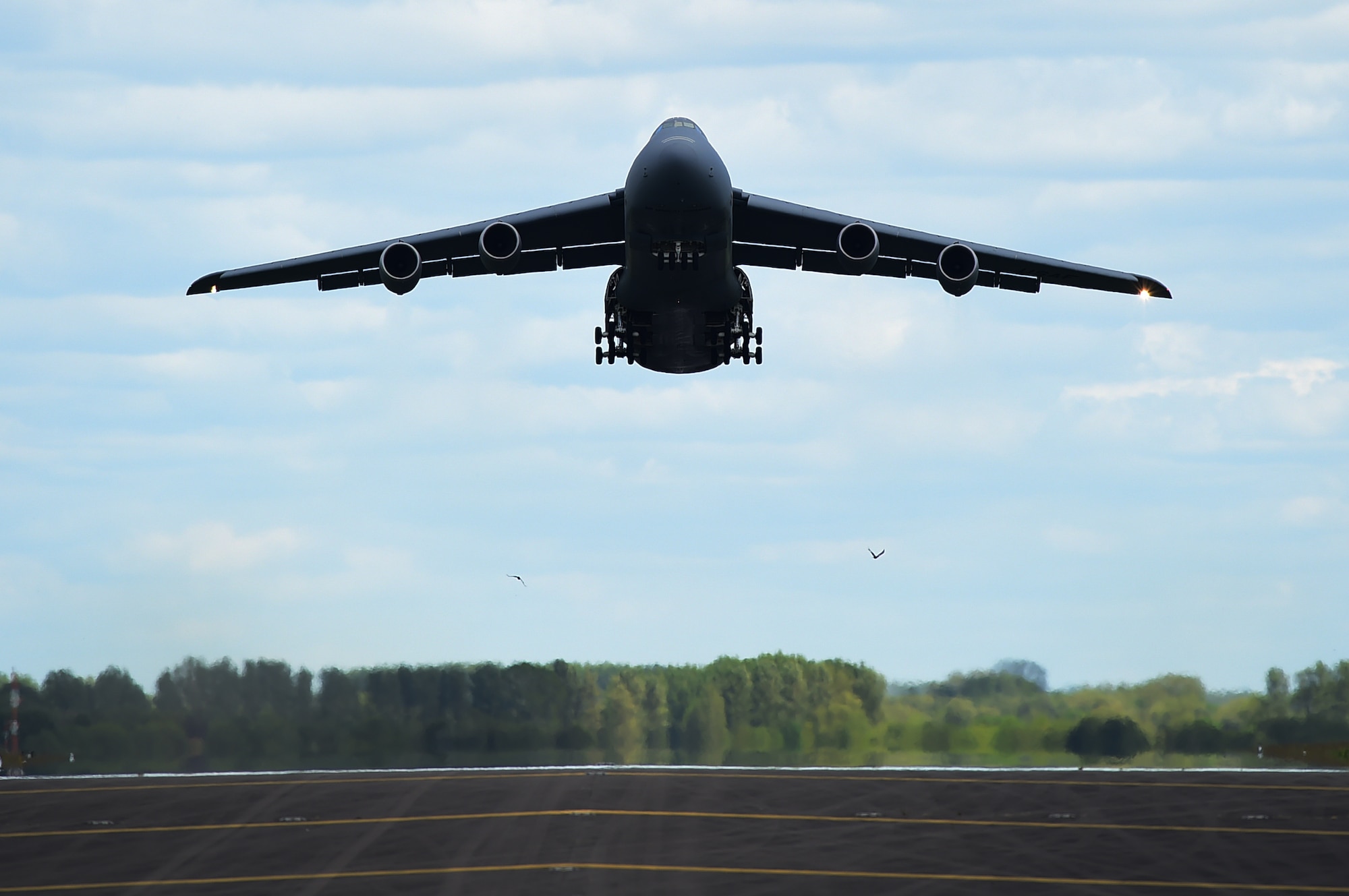 A C-5 Super Galaxy takes off from RAF Fairford, United Kingdom, June 3, 2015, after dropping off cargo in support of U.S. European Command Exercises BALTOPS 15 and SABER STRIKE 15 from June 5-21, 2015. The deployment of U.S. bombers to RAF Fairford, which was coordinated with USEUCOM and NATO, demonstrates the U.S.’s long-standing relationship with UK allies. (U.S. Air Force photo by Tech. Sgt. Chrissy Best)