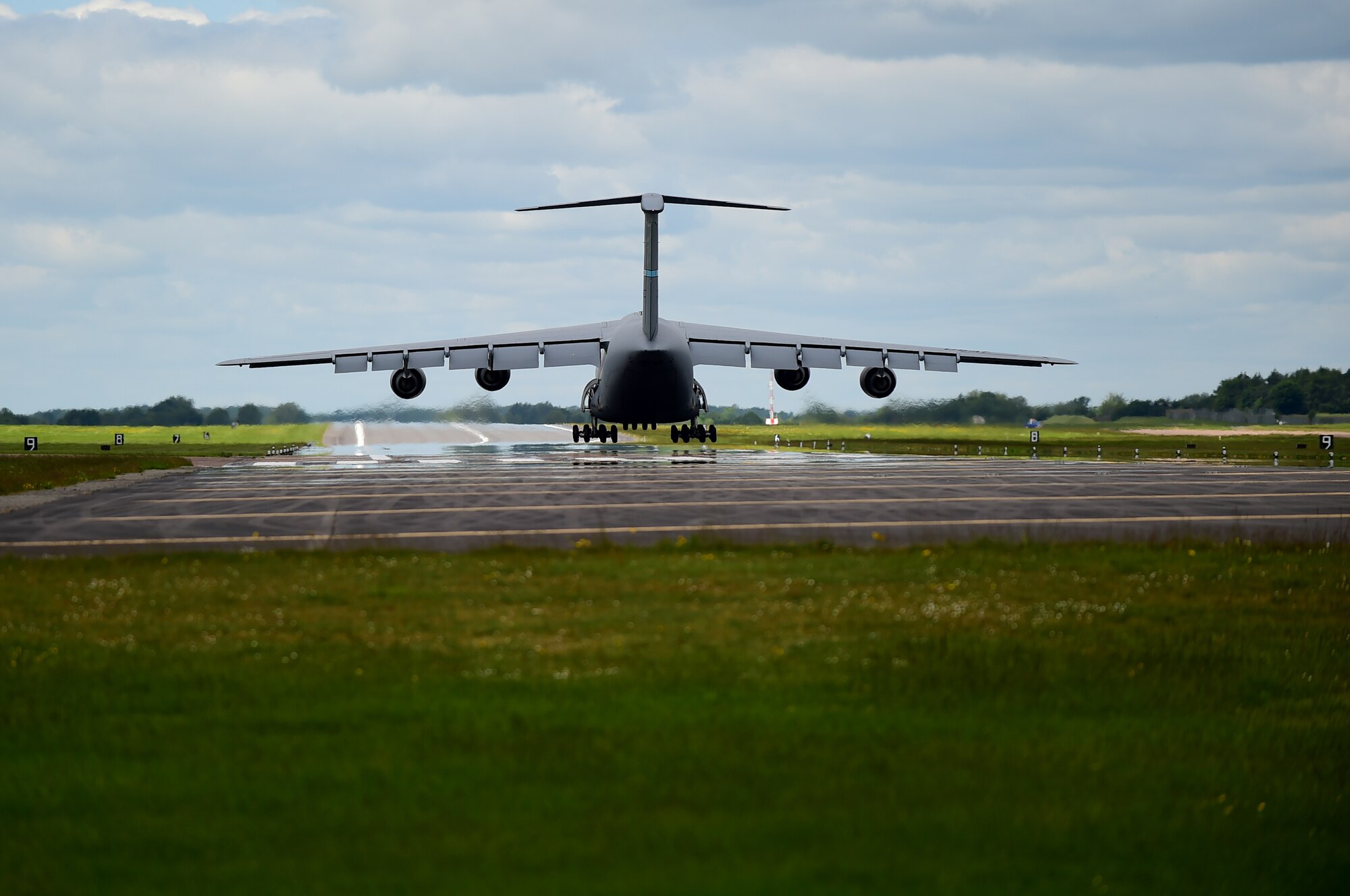 A C-5 Super Galaxy touches down on the RAF Fairford, United Kingdom, flight line, June 3, 2015to drop off cargo in support of U.S. European Command Exercises BALTOPS 15 and SABER STRIKE 15 from June 5-21, 2015. The deployment of U.S. bombers to RAF Fairford, which was coordinated with USEUCOM and NATO, demonstrates the U.S.’s long-standing relationship with UK allies. (U.S. Air Force photo by Tech. Sgt. Chrissy Best)