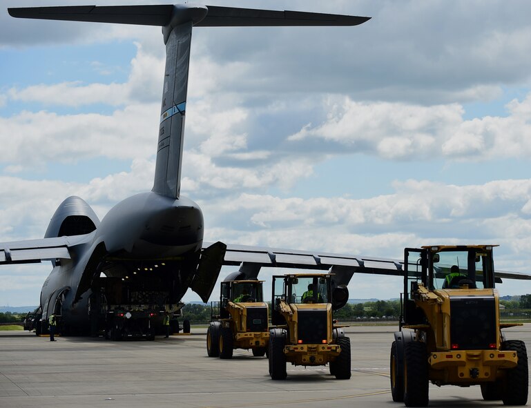 Personnel from the 420th Air Base Squadron personnel unload a C-5 Super Galaxy after landing on RAF Fairford, United Kingdom, June 3, 2015 in support of the U.S. European Command Exercises BALTOPS 15 and SABER STRIKE 15 from June 5-21, 2015. (U.S. Air Force photo by Tech. Sgt. Chrissy Best)