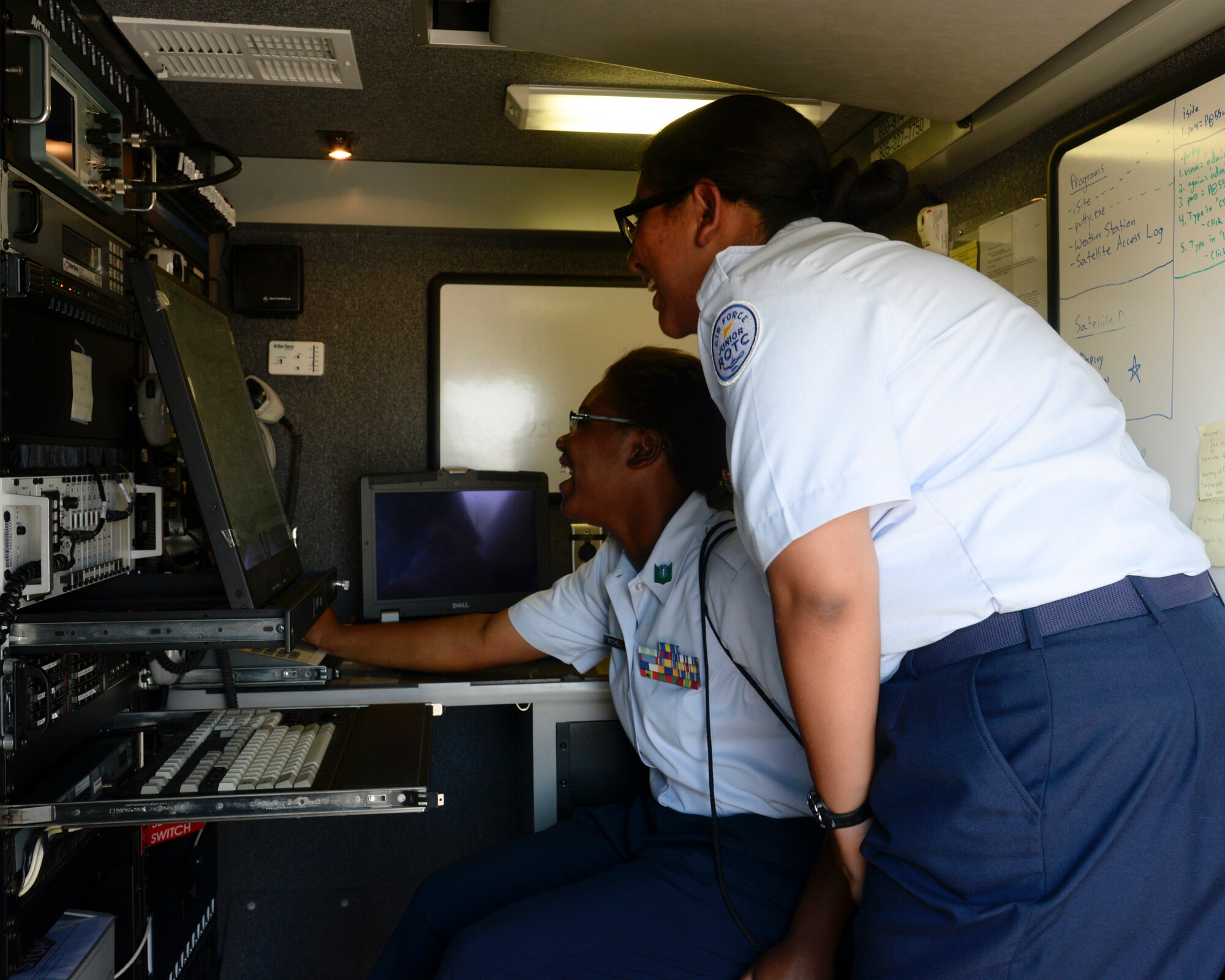 Air Force Junior Reserve Officer Training Corps cadets use emergency management equipment during JROTC Career Day on Barksdale Air Force Base, La., June 10, 2015. Over 120 high school students from the Ark-La-Tex area interacted with Airmen from different career fields as part of their week-long Cadet Leadership Course. (U.S. Air Force photo/ Senior Airman Jannelle Dickey)