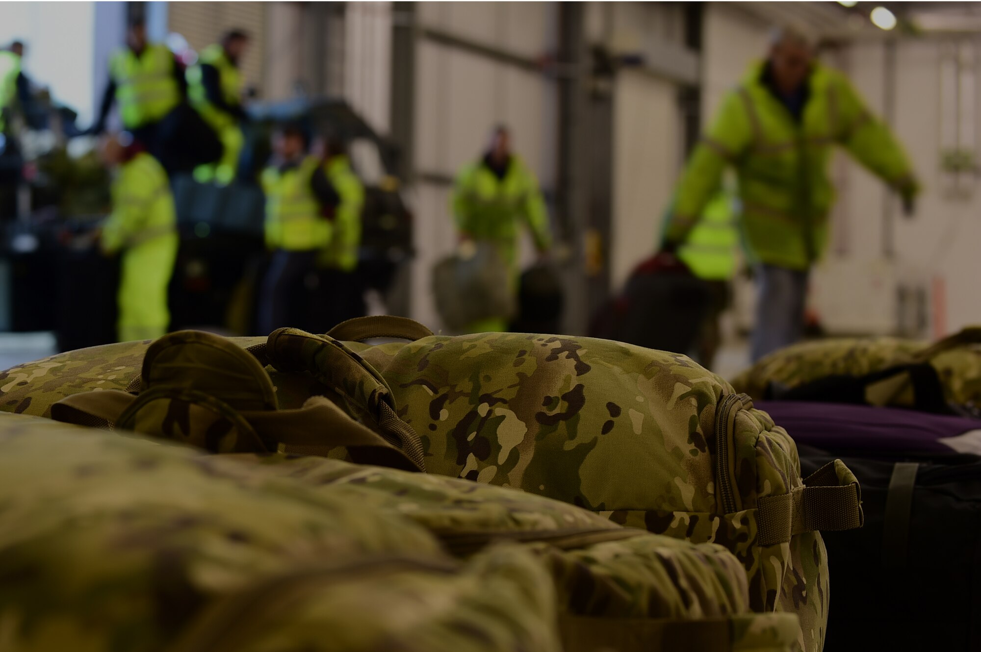 Members of the 420th Air Base Squadron unload the recent deployer’s luggage to be inspected by the Ministry of Defence Police K-9 unit, at RAF Fairford, United Kingdom, June 2, 2015. Approximately 330 Airmen deployed to RAF Fairford to support the U.S. European Command Exercises BALTOPS 15 and SABER STRIKE 15 from June 5-21, 2015. (U.S. Air Force photo by Tech. Sgt. Chrissy Best)