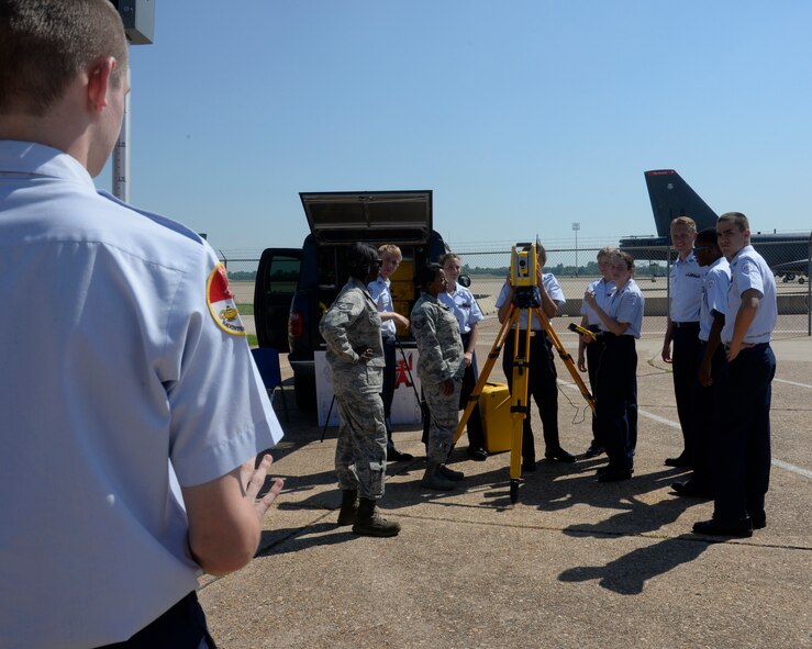 Airmen from the 2nd Civil Engineer Squadron give Air Force Junior Reserve Officer Training Corps cadets a demonstration on surveying equipment during JROTC Career Day on Barksdale Air Force Base, La., June 10, 2015. High school students from the Ark-La-Tex area got the opportunity to meet Airmen from different career fields as part of their week-long Cadet Leadership Course. (U.S. Air Force photo/ Senior Airman Jannelle Dickey)
