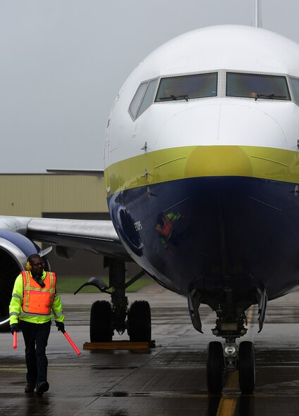 Edmond Davis, 420th Air Base Squadron, aerospace ground equipment craftman, conducts a walk Boeing 737 Airliner, to make sure all is secure, before the pilot shuts off the engines at RAF Fairford, United Kingdom June 2, 2015. RAF Fairford is the considered a ‘warm’ and changed to ‘hot’ status, in support of the Air Force Global Strike Command’s involvement in the BALTOPS and Saber Strike 15 exercises. (U.S. Air Force photo by Tech. Sgt. Chrissy Best)