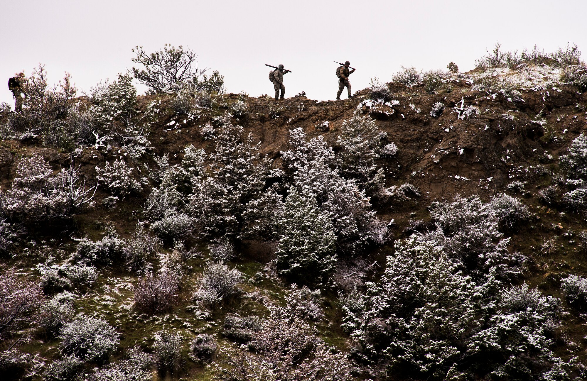 Airman 1st Class Gerald Styles, Senior Airman Guy Reeves, security forces airmen for the 570th Global Mobility Readiness Squadron from Travis Air Force Base, Calif., set up for sniper attack during an attack scenario on a missile convoy while working as opposing forces against the 91st Missile Wing, assigned to Minot Air Force Base, N.D., during Operation Road Warrior at Camp Guernsey, Wyo., May 20, 2015. 
Operation Road Warrior, the largest security forces exercise conducted each year, is an Air Force Global Strike Command exercise held annually at Camp Guernsey, Wyo., which evaluates tactics, techniques, and procedures used to secure nuclear–capable weapons and critical intercontinental ballistic missile (ICBM) components during convoy operations and provided direct feedback to the three participating ICBM wings; the 91st Missile Wing, assigned to Minot AFB, N.D., 90th Missile Wing assigned to F.E. Warren AFB, Wyo., and 341st Missile Wing assigned to Malmstrom AFB, Mont.. (U.S. Air Force photos by Tech. Sgt. Matthew Hannen)
 
