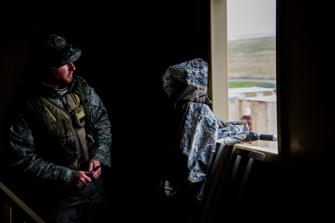 Airman 1st Class Kevin Anthony, a security forces airman for the 570th Global Mobility Readiness Squadron from Travis Air Force Base, Calif., sets up deceptive decoy prior to a missile convoy attack scenario while working as opposing forces to attack a missile convoy from the 91st Missile Wing, assigned to Minot Air Force Base, N.D., during Operation Road Warrior at Camp Guernsey, Wyo., May 19, 2015. 
Operation Road Warrior, the largest security forces exercise conducted each year, is an Air Force Global Strike Command exercise held annually at Camp Guernsey, Wyo., which evaluates tactics, techniques, and procedures used to secure nuclear–capable weapons and critical intercontinental ballistic missile (ICBM) components during convoy operations and provided direct feedback to the three participating ICBM wings; the 91st Missile Wing, assigned to Minot AFB, N.D., 90th Missile Wing assigned to F.E. Warren AFB, Wyo., and 341st Missile Wing assigned to Malmstrom AFB, Mont.. (U.S. Air Force photos by Tech. Sgt. Matthew Hannen)
