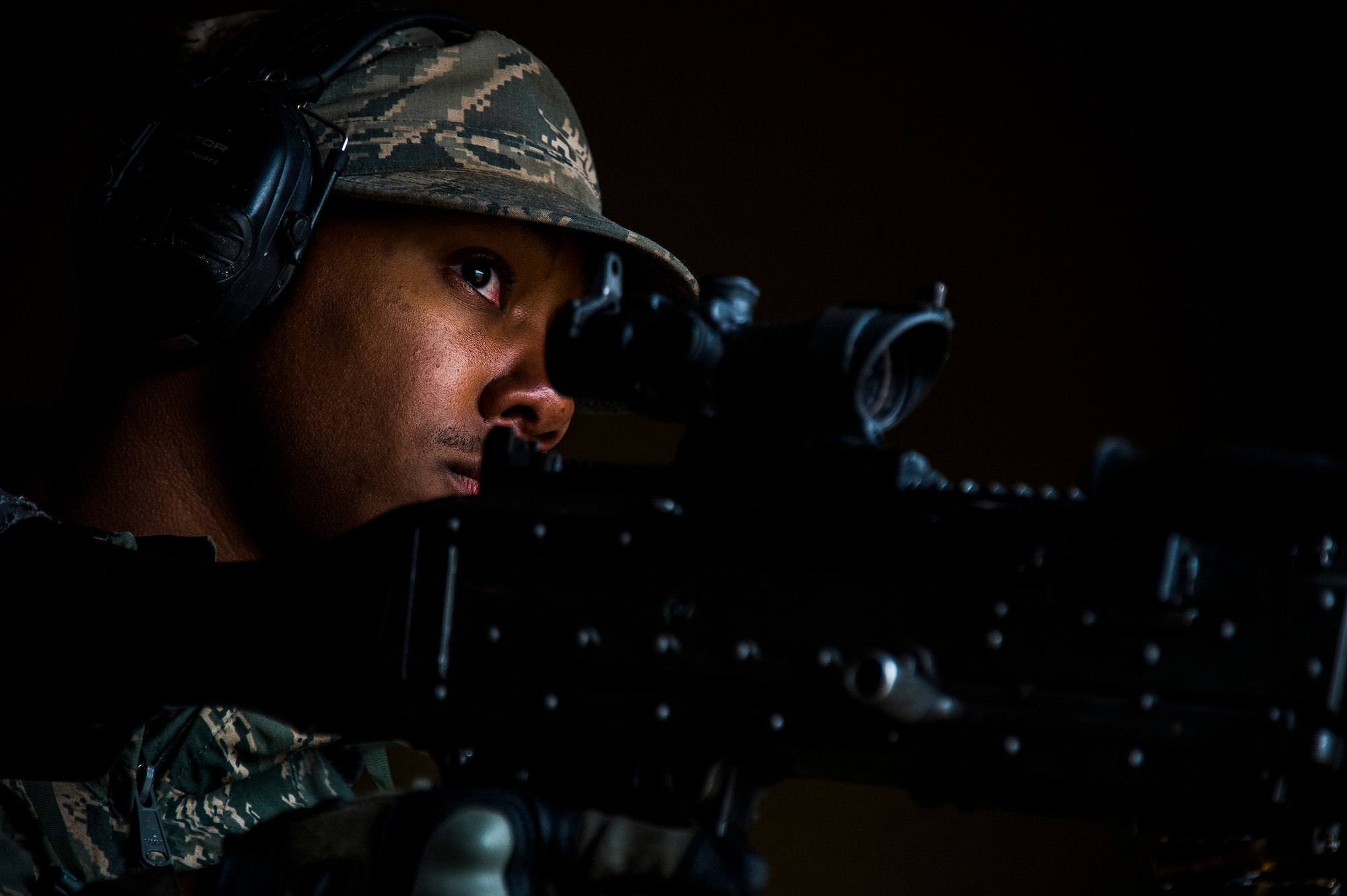 Senior Airman Vidarion McDaniel, a security forces airman for the 570th Global Mobility Readiness Squadron from Travis Air Force Base, Calif., waits to shoot during an attack scenario on a missile convoy while working as opposing forces against the 91st Missile Wing, assigned to Minot Air Force Base, N.D., during Operation Road Warrior at Camp Guernsey, Wyo., May 19, 2015. 
Operation Road Warrior, the largest security forces exercise conducted each year, is an Air Force Global Strike Command exercise held annually at Camp Guernsey, Wyo., which evaluates tactics, techniques, and procedures used to secure nuclear–capable weapons and critical intercontinental ballistic missile (ICBM) components during convoy operations and provided direct feedback to the three participating ICBM wings; the 91st Missile Wing, assigned to Minot AFB, N.D., 90th Missile Wing assigned to F.E. Warren AFB, Wyo., and 341st Missile Wing assigned to Malmstrom AFB, Mont.. (U.S. Air Force photos by Tech. Sgt. Matthew Hannen)

