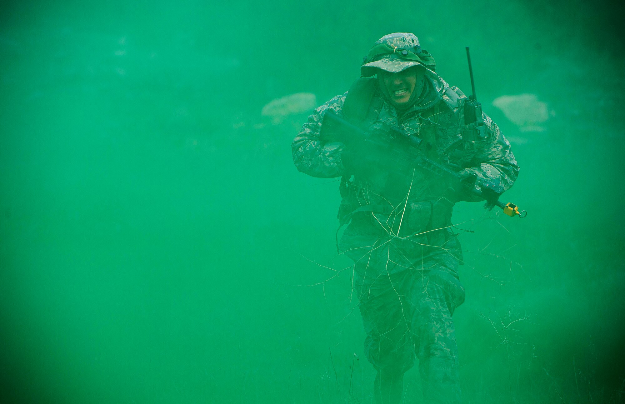 Master Sgt. John Cruz-Cortez, a security forces airman for the 570th Global Mobility Readiness Squadron from Travis Air Force Base, Calif., moves into position to provide rear security for opposing forces assault team during a missile convoy attack scenario against the 91st Missile Wing, assigned to Minot Air Force Base, N.D., at Operation Road Warrior at Camp Guernsey, Wyo., May 17, 2015. 
Operation Road Warrior, the largest security forces exercise conducted each year, is an Air Force Global Strike Command exercise held annually at Camp Guernsey, Wyo., which evaluates tactics, techniques, and procedures used to secure nuclear–capable weapons and critical intercontinental ballistic missile (ICBM) components during convoy operations and provided direct feedback to the three participating ICBM wings; the 91st Missile Wing, assigned to Minot AFB, N.D., 90th Missile Wing assigned to F.E. Warren AFB, Wyo., and 341st Missile Wing assigned to Malmstrom AFB, Mont..  (U.S. Air Force photos by Tech. Sgt. Matthew Hannen)
