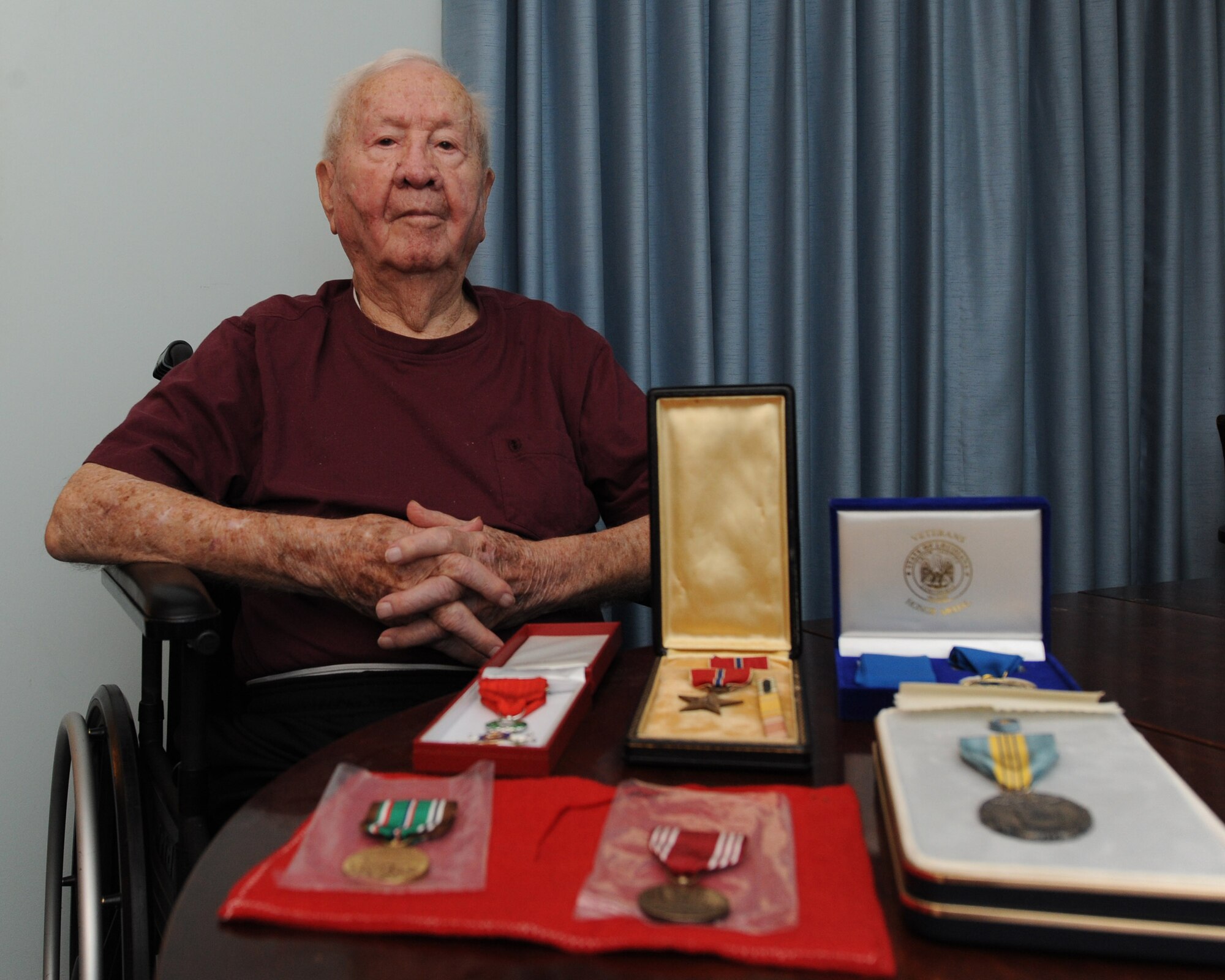John Carpenter, World War II veteran, poses for a photo at his home in Shreveport, La., June 3, 2015. Carpenter served in the military in the 1930s and re-enlisted for World War II in 1943. His service earned him honorary medals to include the Bronze Star and the French Legion of Honor. (U.S. Air Force photo/ Senior Airman Jannelle Dickey)