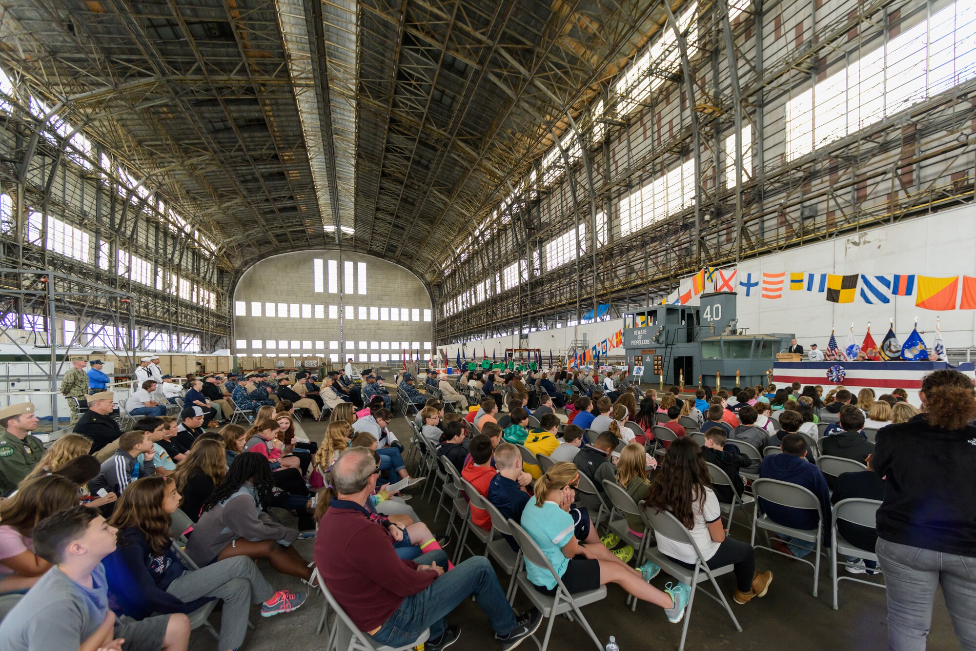 More than 300 community members assembled aboard the flight deck in Hangar One to commemorate the historic battle that shifted the tide of World War II in the Pacific, marking the 73rd Anniversary of the Battle of Midway, June 6, 2015. (U.S. Air Force photo by Robert Williard/Released)