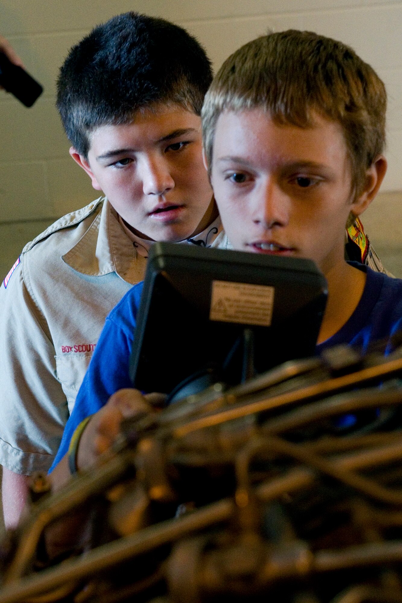 Cory Rowan and Pat McClain, both Troop 570 boy scouts from Kokomo, Ind., look at a borescope inspection device on a KC135R Stratotanker aircraft engine during a tour of Grissom Air Reserve Base, Ind., June 10, 2015.  An engine borescope gives propulsion technicians a closer look at the internal workings of an aircraft engine without disassembling the engine. (U.S. Air Force photo/Tech. Sgt. Benjamin Mota)