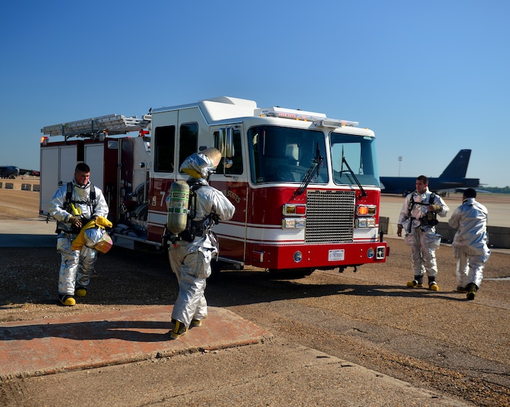Firefighters from the 2nd Civil Engineer Squadron participate in an oil spill response exercise on Barksdale Air Force Base, La., June 10, 2015. The exercise was designed to maximize response time to an incident while reducing its environmental impact. (U.S. Air Force photo/Airman 1st Class Mozer O. Da Cunha)