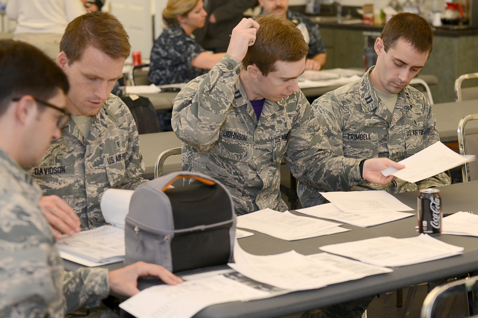 A team of four U.S. Air Force dental residents work to link simulated dental records to human remains during a dental forensics exercise at Langley Air Force Base, Va., June 5, 2015. For dental students at Langley, Dental residency training lasts a year and covers lessons including oral surgery and forensics. (U.S. Air Force photo by Airman 1st Class Devin S. Michaels/Released)