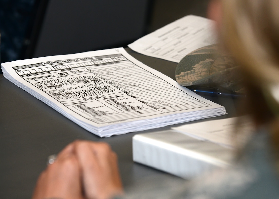 U.S. Air Force and Navy dental residents attended forensics training taught by U.S. Naval Capt. Kevin Torske, Navy Medical Center Portsmouth staff pathologist, at Langley Air Force Base, Va., June 5, 2015. The training included a simulated emergency investigation with realistic updates as if it were a developing investigation. (U.S. Air Force photo by Airman 1st Class Devin S. Michaels/Released)