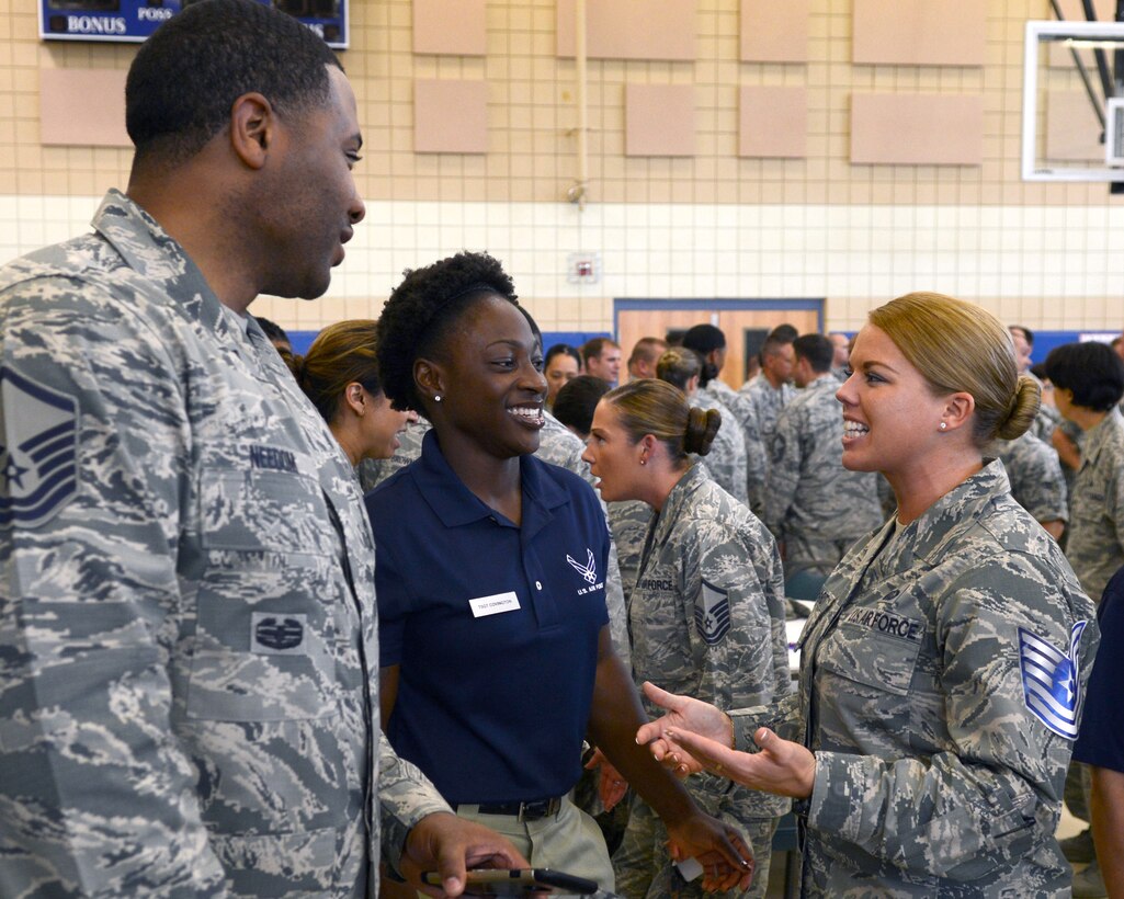 U.S. Air Force Staff Sgt. Cassandra Bernhardt, 633rd Force Support Squadron Community Commons program director and technical sergeant select, talks with her coworkers at Langley Air Force Base, Va., June 9, 2015. After an official ceremony and congratulations, the new technical sergeants celebrated with their family, friends and coworkers. (U.S. Air Force photo by Airman 1st Class Devin S. Michaels/Released)