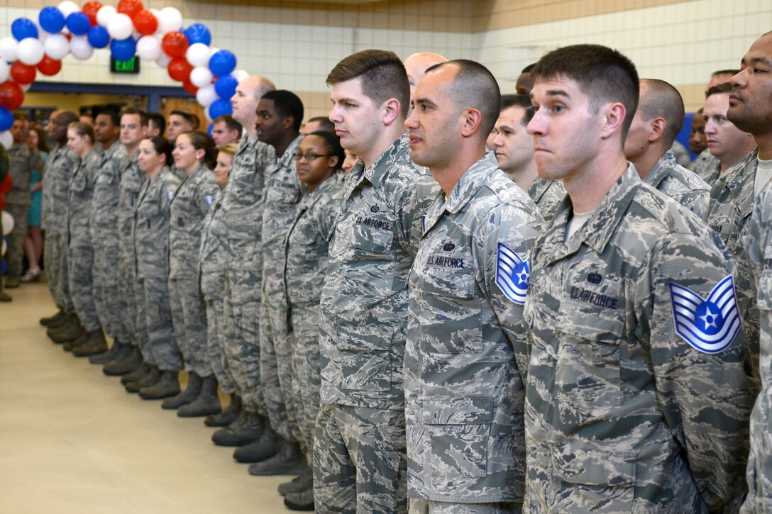 U.S. Air Force technical sergeant selects line up while Chief Master Sgt. Orlando Pabon, 633rd Medical Group superintendent, offers them advice to follow in their new rank at Langley Air Force Base, Va., June 9, 2015. Pabon said the promoted individuals’ families deserve credit for the rank because they too made sacrifices for the betterment of the Air Force. (U.S. Air Force photo by Airman 1st Class Devin S. Michaels/Released)