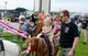 Members of the 132d Wing (132WG), Des Moines, Iowa and their families participate in the 2015 Annual Family Day held at the 132WG on Saturday, June 6, 2015. Captain Phillip Peters escorts his daughter during pony rides at the 2015 Family Day at the 132d Wing.  (U.S. Air National Guard photo by Senior Airman Michael J. Kelly/Released)