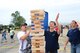 Members of the 132d Wing (132WG), Des Moines, Iowa and their families participate in the 2015 Annual Family Day held at the 132WG on Saturday, June 6, 2015. Senior Airman Connor Sprague and members of Student Flight play Jenga.  (U.S. Air National Guard photo by Senior Airman Michael J. Kelly/Released)