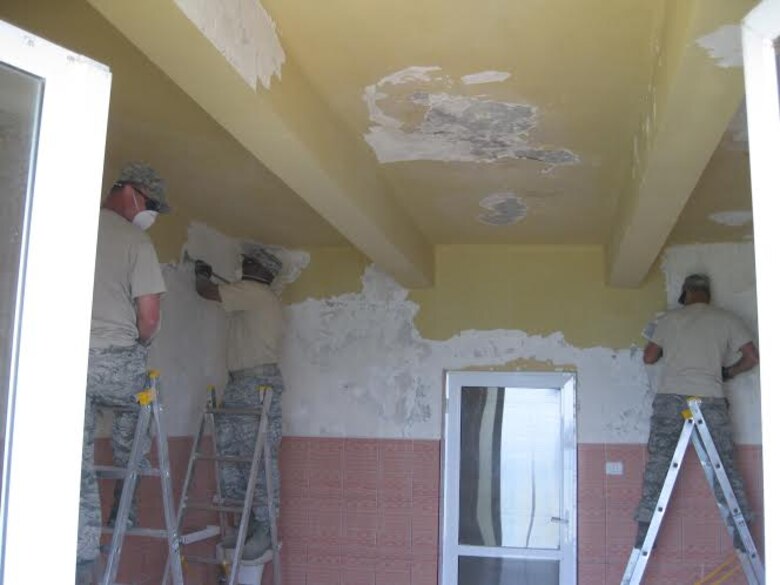 Alabama Guardsmen from the 117th Air Refueling Wing Civil Engineering Squadron renovate a Romanian medical clinic as part of a Deployment for Training mission April 2015 .  (Courtesy Photo/Released)