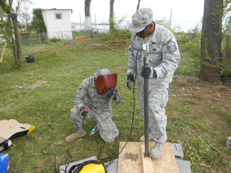 Alabama Guardsmen from the 117th Air Refueling Wing Civil Engineering Squadron renovate a Romanian medical clinic as part of a Deployment for Training mission April 2015 .  (Courtesy Photo/Released)