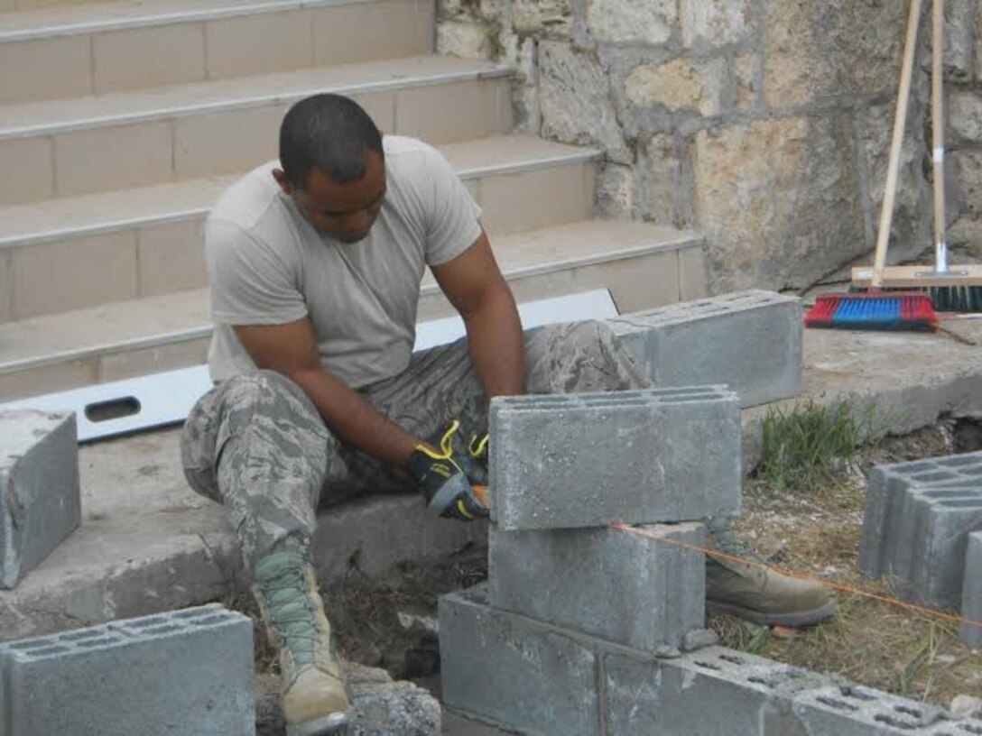 Alabama Guardsmen from the 117th Air Refueling Wing Civil Engineering Squadron renovate a Romanian medical clinic as part of a Deployment for Training mission April 2015 .  (Courtesy Photo/Released)