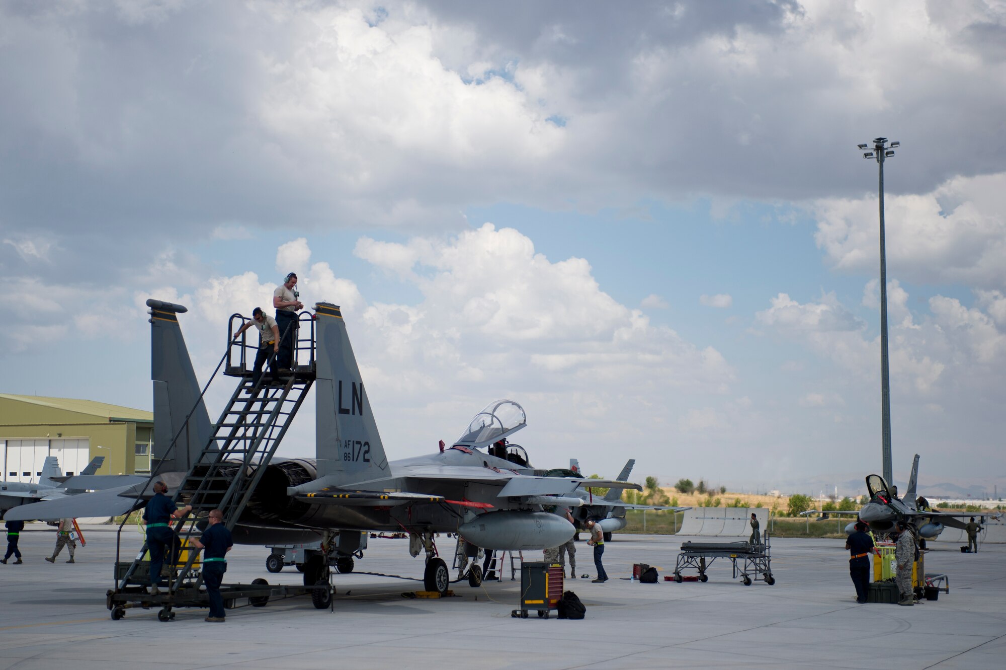 48th Fighter Wing Airmen work on an F-15C Eagle from the 493rd Fighter Squadron during Anatolian Eagle 15 at 3rd Main Jet Base, Turkey, June 10, 2015. Approximately 250 personnel and 12 F-15 aircraft from the 48th FW, Royal Air Force Lakenheath, England, are participating in the two-week exercise. (U.S. Air Force photo by Tech. Sgt. Eric Burks/Released)