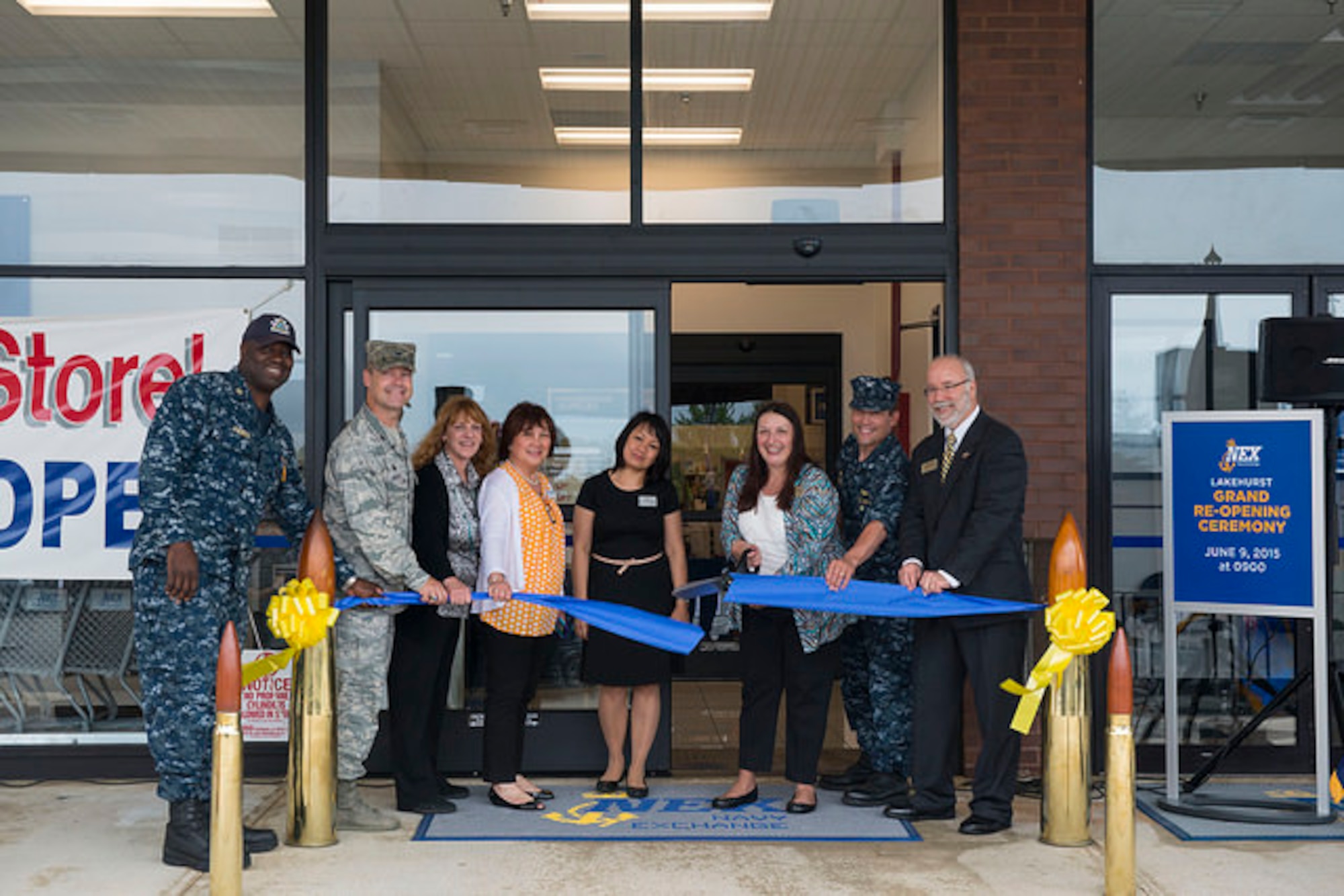 Joint Base McGuire-Dix-Lakehurst leaders and community members cut a ribbon signifying the Navy Exchange’s grand reopening on JB MDL, N.J. June 9, 2015. The NEX opened recently after a year of renovations.   (U.S. Air Force photo by Airman 1st Class Joshua King)