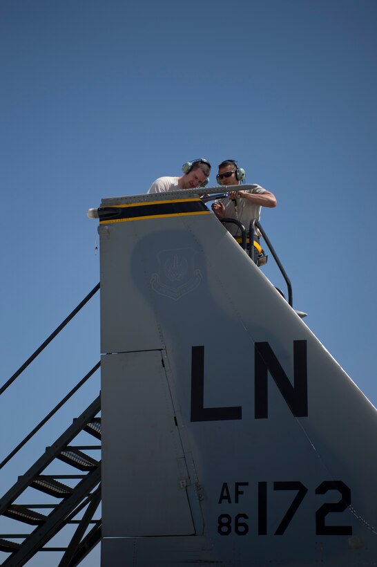 Two maintainers from the 748th Aircraft Maintenance Squadron work on an F-15C Eagle assigned to the 493rd Fighter Squadron during Anatolian Eagle 15 at 3rd Main Jet Base, Turkey, June 10, 2015. Maintainers are responsible for overseeing the day-to-day maintenance of aircraft, including diagnosing malfunctions and replacing components, and conducting various inspections to ensure the aircraft is functioning properly. (U.S. Air Force photo by Tech. Sgt. Eric Burks/Released)