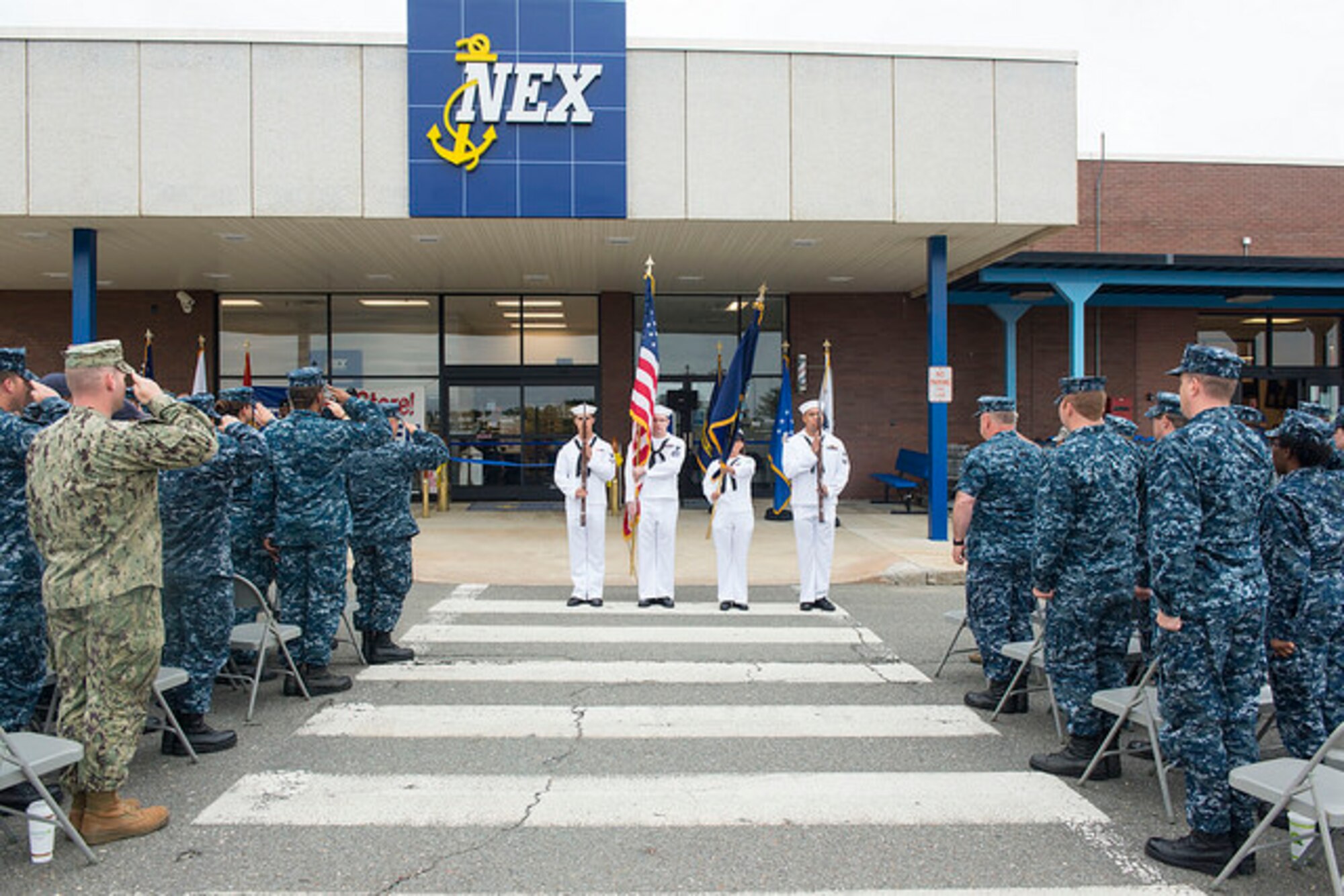 Navy ceremonial guardsmen present the colors during Navy Exchange’s grand reopening on Joint Base McGuire-Dix-Lakehurst, N.J. June 9, 2015. The NEX opened recently after a year of renovations. (U.S. Air Force photo by Airman 1st Class Joshua King) 
