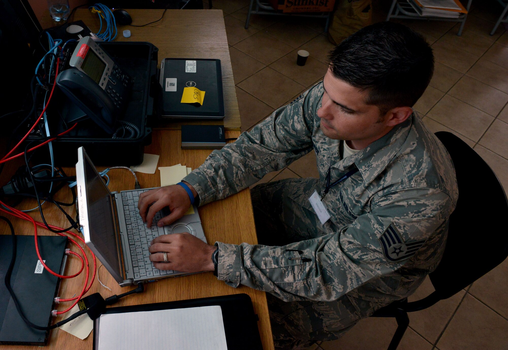 Staff Sgt. Dean Gage, 1st Combat Communications Squadron cyber systems supervisor, configures infrastructure equipment during Baltic Operations 2015, June 10, 2015, at Powidz Air Base, Poland. BALTOPS is designed to enhance flexibility and interoperability, as well as demonstrate resolve of allied and partner forces to defend the Baltic region. (U.S. Air Force photo by Senior Airman Michael Battles)