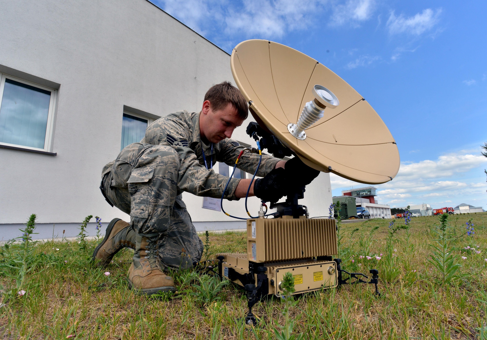 Senior Airman Brendan Kennedy, 1st Combat Communications Squadron satellite communications technician, calibrates a L3 Panther during Baltic Operations 2015, June 10, 2015, at Powidz Air Base, Poland. During rotational deployments such as BALTOPS, each Airmen on the communications team is selected due to their specific skills sets. (U.S. Air Force photo by Senior Airman Michael Battles)