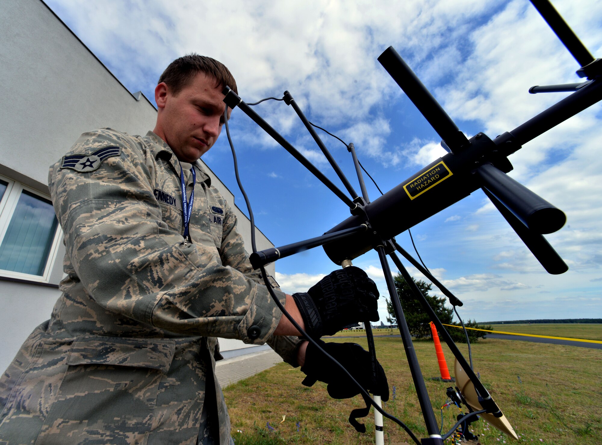 Senior Airman Brendan Kennedy, 1st Combat Communications Squadron satellite communications technician, adjusts an AV-211 Antenna during Baltic Operations 2015, June 10, 2015, at Powidz Air Base, Poland. BALTOPS is a multinational maritime exercise in Poland, Sweden, Germany, and throughout the Baltic Sea, including participation from 14 NATO and three partner nations, June 5-20. (U.S. Air Force photo by Senior Airman Michael Battles)