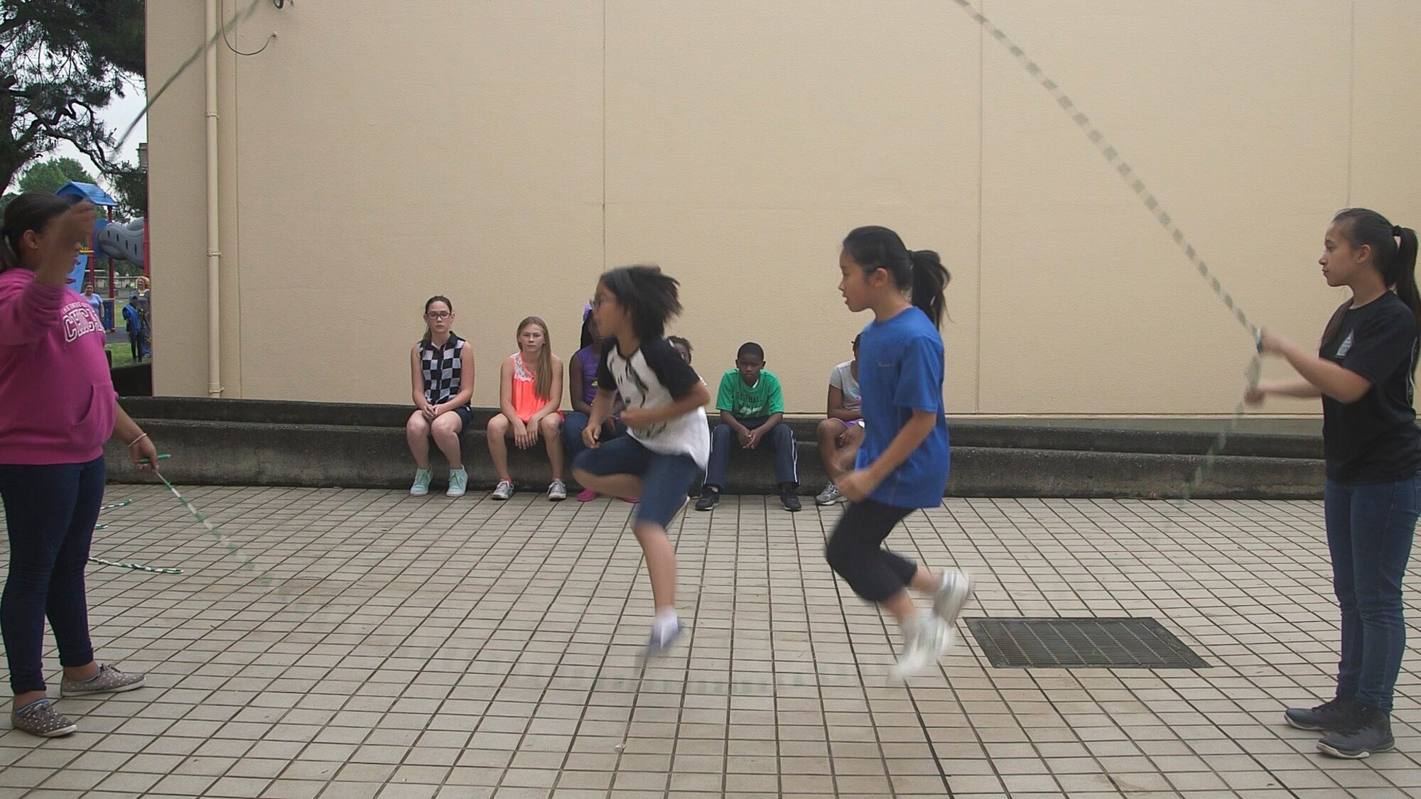 Students from Yokota West Elementary School jump rope during recess at Yokota Air Base, Japan, June 2, 2015. The Recess Before Lunch program allows students to get involved in physical activity prior to consumption of nutrients. (U.S. Air Force photo by Staff Sgt. Dustin Payne/Released)