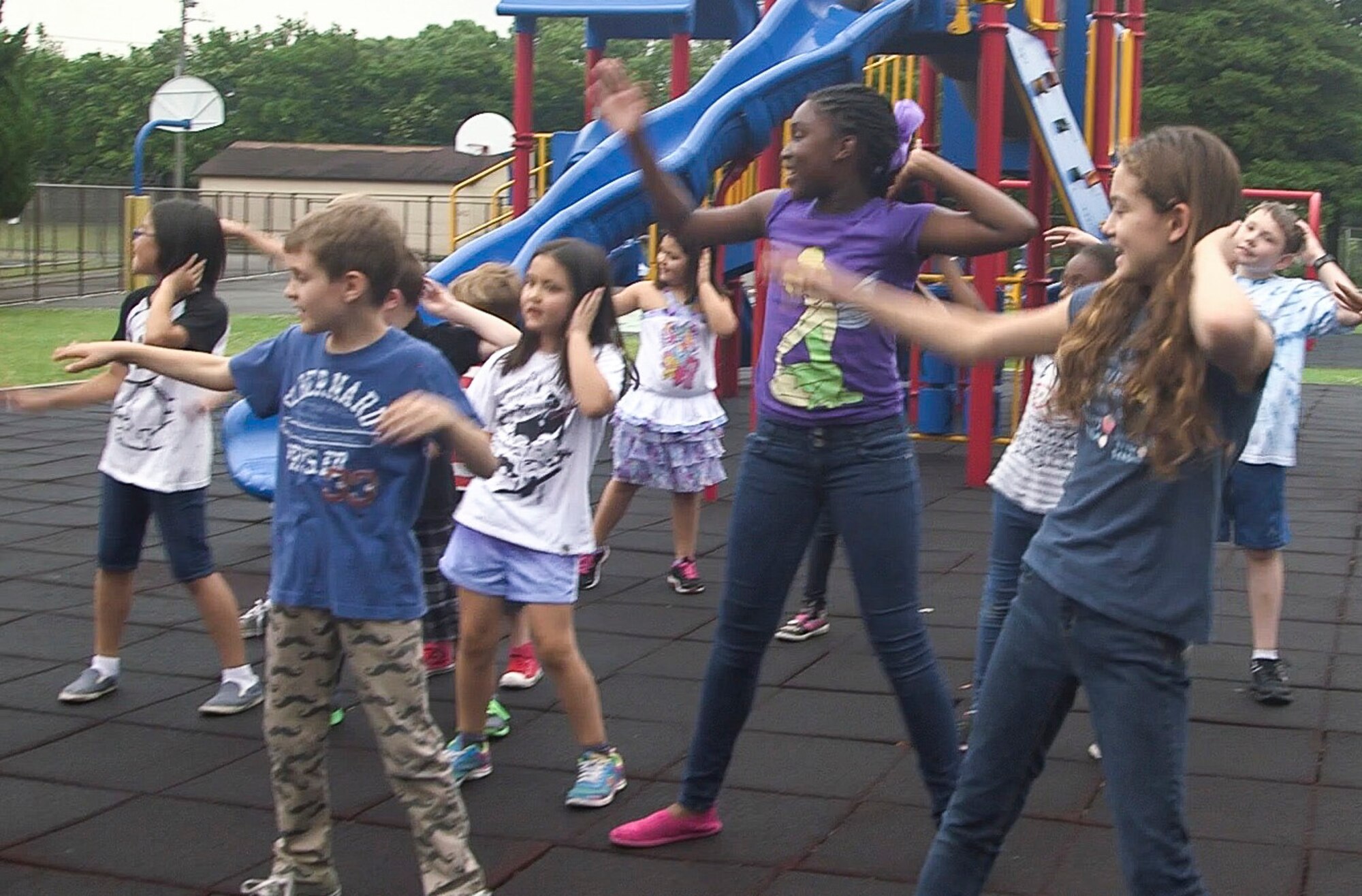 Students from Yokota West Elementary School dance during a performance to raise awareness for the Recess Before Lunch program at Yokota Air Base, Japan, June 2, 2015. The program is part of the Healthy Base Initiative. (U.S. Air Force photo by Staff Sgt. Dustin Payne/Released)