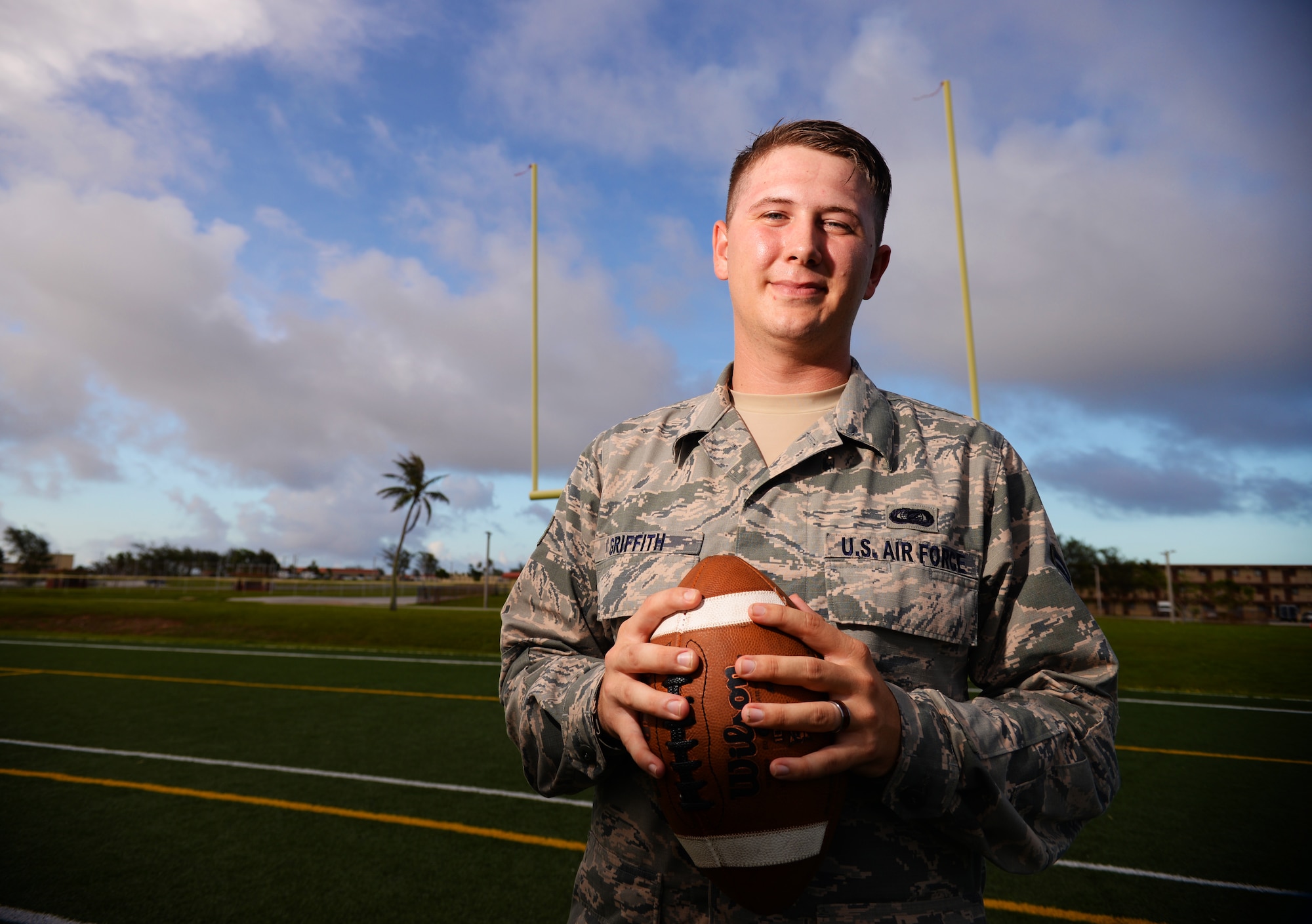 Senior Airman Presley Griffith, 36th Mobility Response Squadron executive assistant, offers a free football spring practice camp as volunteer coach at Andersen Air Force Base, Guam. A former high school quarterback, Griffith is working toward his goal of becoming a high school football coach. (U.S. Air Force photo by Senior Airman Alexander W. Riedel/Released)