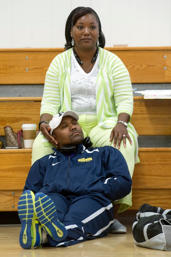 Navy Chief Petty Officer Averill Malone rests on his wife, Ida, during the Navy’s training camp for the 2015 DoD Warrior Games at Ventura County Naval Station Port Hueneme in Oxnard, Calif., June 3, 2015. DoD photo by EJ Hersom