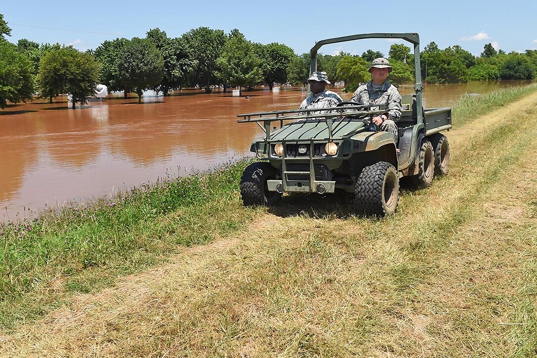 Army Staff Sgt. Raymond Morgan, right, and Sgt. Ramirez Allums patrol a levee in Bossier City, La., inspecting for seepage or other potential problems in response to flooding along the Red River, June 9, 2015. Morgan and Allums are cavalry scouts assigned to the Louisiana National Guard's 2nd Squadron, 108th Cavalry Regiment. 
