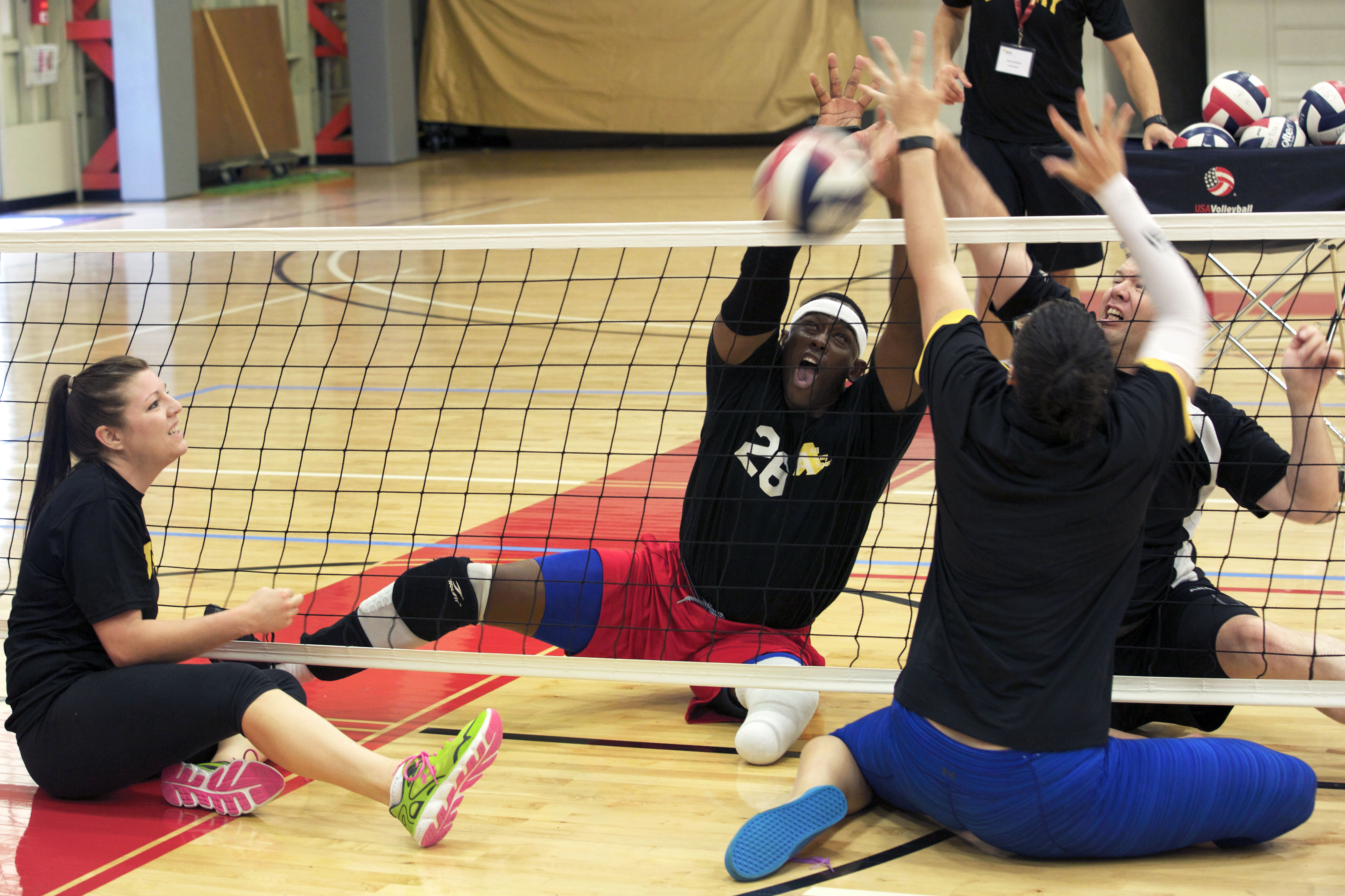 Army activeduty and veteran athletes conduct sitting volleyball