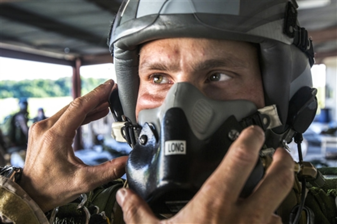 A Marine gets his oxygen mask inspected before conducting a high-altitude, high-opening jump during sustainment training in Louisburg, N.C., June 6, 2015. The training allowed the Marines to prepare for deployment to the 5th and 6th Fleet areas of responsibility later this year. The Marine is assigned to Maritime Raid Force, 26th Marine Expeditionary Unit.