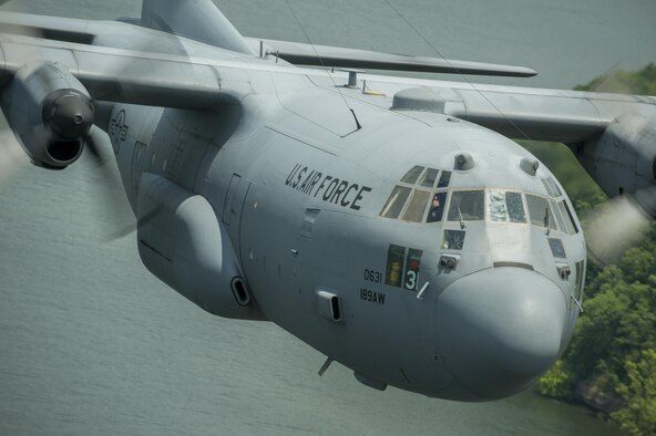 An Airman from the 189th Airlift Wing gives a thumbs-up during a training flight June 8, 2015, near Little Rock Air Force Base, Ark. The Air Education and Training Command’s 314th AW and Arkansas Air National Guard’s189th AW provide the foundation of combat airlift with initial training in the C-130J Super Hercules and C-130H Hercules. (U.S. Air Force photo/Senior Airman Scott Poe)  