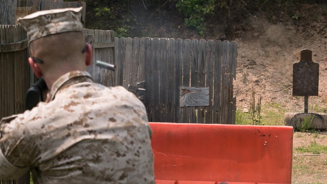 A Guard Marine from Marine Barracks Washington, shoots an M1014 shotgun during a training exercise at Range 5, Marine Corps Base Quantico, Virginia, June 10, 2015. 1st platoon, Guard Company, traveled there to increase overall marksmanship with the M9 service pistol, the M4 service rifle and M1014 shotgun. 