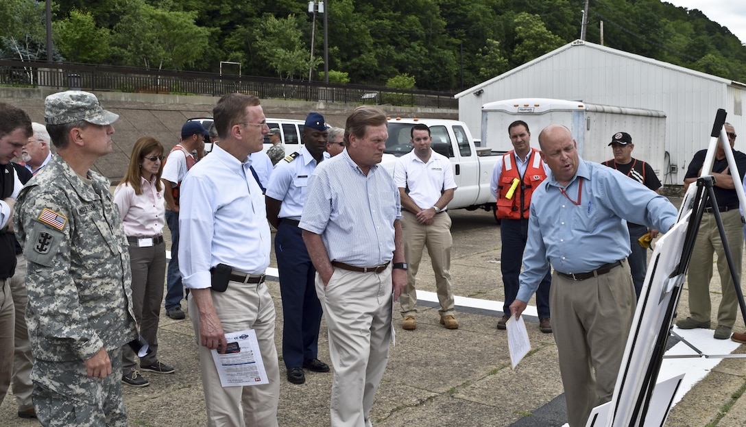 Chairman Mike Simpson (right), House Energy and Water Development Appropriations Subcommittee, and Congressman Tim Murphy (middle) receive a overview of Locks and Dam 4 on the Monongahela River at Charleroi, Pa., from Steve Fritz (far right), a Pittsburgh District civil engineer, June 5.